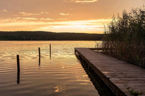 Sunset at the bathing jetty of the Großer Glubigsee near Wendisch Rietz, Oder-Spree district,