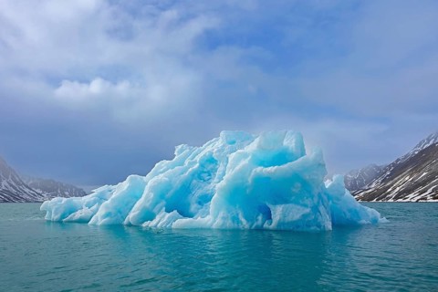 Iceberg melting in summer in Magdalenefjorden, fjord in Albert I Land on Svalbard, Spitsbergen,