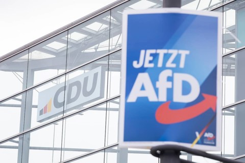 An election poster of the far-right AfD party (now AfD) hangs in front of the CDU logo in front of