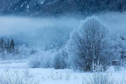 Isar valley in winter at temperatures of minus 18 degrees Celsius. Snow covered landscape with the