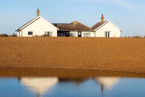 The Beacons bungalow house on beach at Shingle Street, Hollesley Bay, Suffolk, England, UK