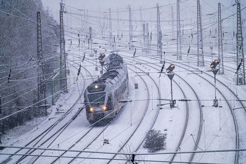 Winter weather, heavy snowfall, railway tracks in front of Essen central station, local train,
