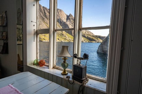 View from the window of a café, fishing village Nusfjord, Lofoten, Norway, Europe