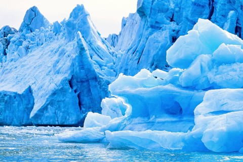 Iceberg by a glacier floating in the sea in Arctic Svalbard, Norway, Europe