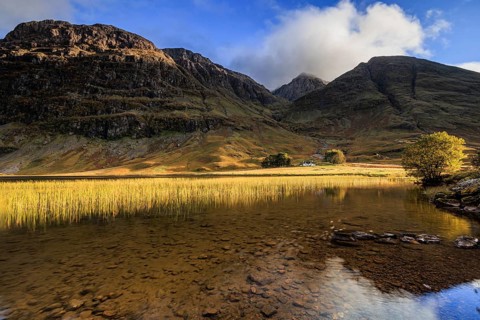 Mountains reflected in loch, evening light, cloudy mood, Achnambeithach Cottage, Loch Achtriochtan,