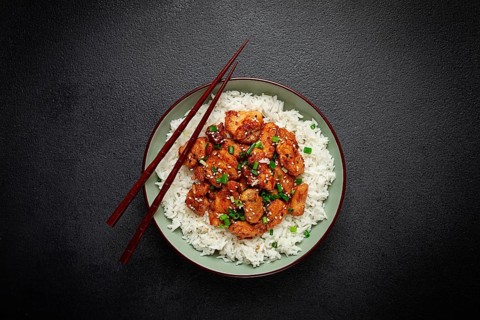 Fried chicken teriyaki with rice, green onion and sesame, homemade, no people