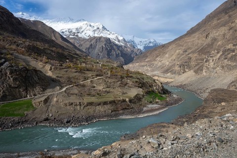View of an Afghan village on the Panj River, Gorno-Badakhshan Province, Tajikistan, Central Asia,
