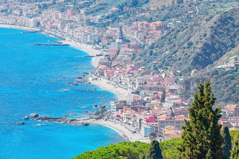 View of the Ionian coast and Giardini di Naxos in the distance, Taormina, Sicily, Italy, Europe