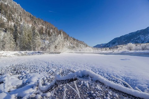 Isar valley in winter at temperatures of minus 18 degrees Celsius. Snow covered landscape with the