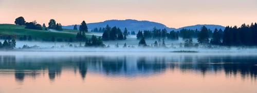 Morning fog at sunrise at Bannwaldsee near Füssen, Allgäu, Bavaria, Germany, Europe