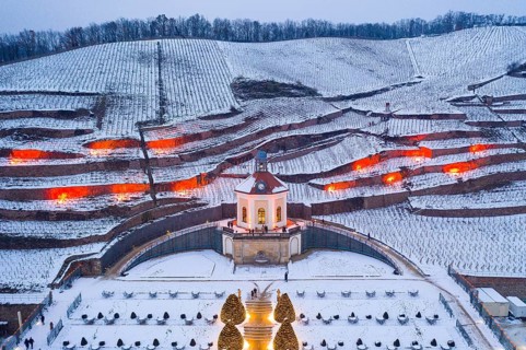 Aerial view of the Belvedere in Wackerbarth Castle Park with vineyards under snow and Christmas