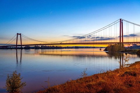 The Emmerich Rhine Bridge, federal road B220, evening light, at 803 m the longest suspension bridge