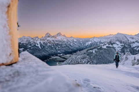 Summit bliss in the snow-covered winter landscape in the Tannheimer Tal in the Alps on the