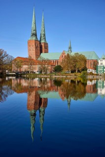 Mill pond with Lübeck Cathedral, symmetrical reflections on the water surface, Hanseatic city of