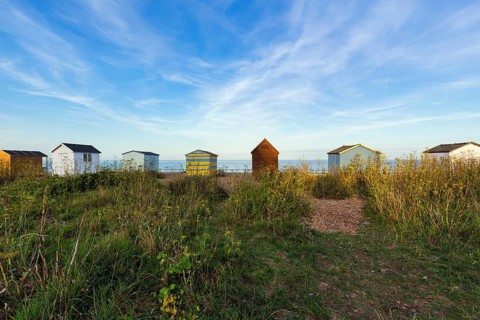 Colourful beach huts on a shingle beach, Cirrus, Kingsdown Beach, English Channel, Dover, Kent,