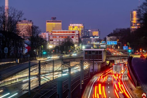 Motorway A40, Ruhr expressway, heavy traffic jam, rush hour, city passage in Essen, skyline of the