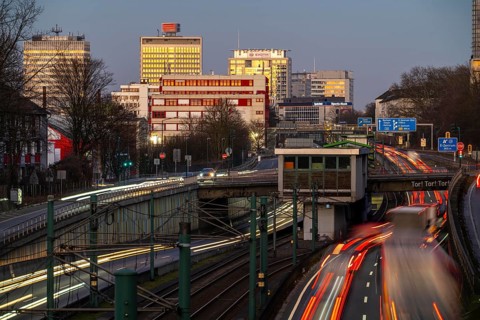 Motorway A40, Ruhr expressway, heavy traffic jam, rush hour, city passage in Essen, skyline of the