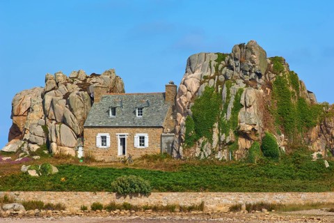 House between rocks, Le Gouffre de Plougrescant, Cote de Granit Rose, Cotes d'Armor, Brittany,