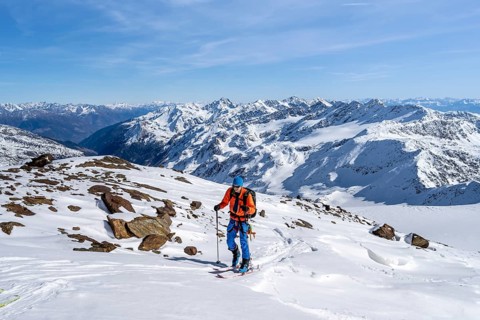 Ski tourers on a high tour on the Fürkeleferner glacier, view of the mountain panorama,