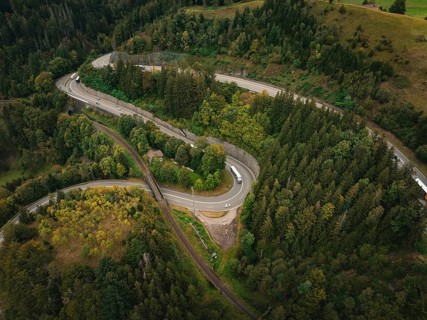 Winding road through green forest from a bird's eye view, Ravenna Gorge, Black Forest, Germany,