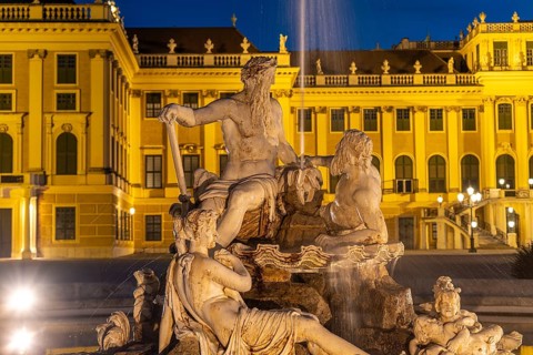 Fountain in the courtyard of honour at Schönbrunn Palace at dusk, UNESCO World Heritage Site in