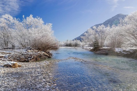 Isar valley in winter at temperatures of minus 18 degrees Celsius. Snow covered landscape with the