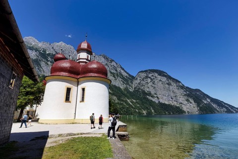 Pilgrimage church St. Bartholomä am Königssee with tourists, Berchtesgaden National Park,