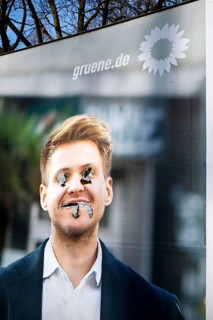 Denigration of a large poster for the 2025 federal election by the Greens with Max Lucks, Bochum,