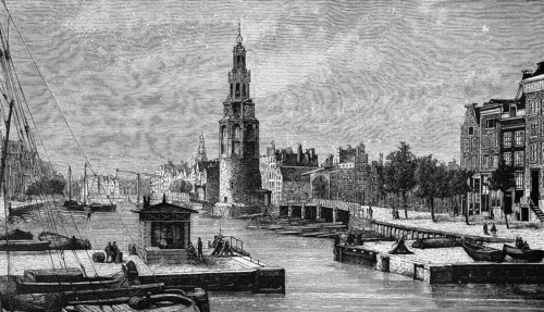 Harbour basin of the Dutch capital Amsterdam with Montelbaanstoren tower, lock, shipping traffic,