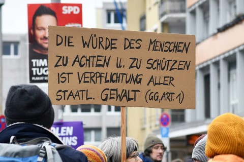 Heidelberg, Germany - February 12th 2025: Protest sign with text quoting the Basic Law for the