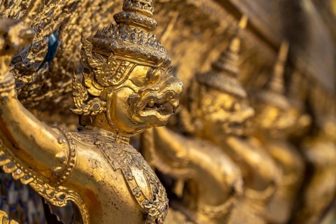 Row of gilded garudas, Wat Phra Kaeo, the king's Buddhist temple in the old royal palace, Grand
