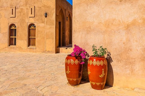 An inner courtyard of the palace fortress of Jabrin, decorated with large flower vases, Jabrin,