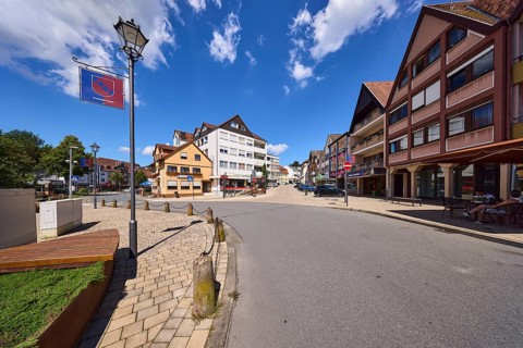 Lantern, general development, town coat of arms, blue sky with cumulus clouds, intersection of