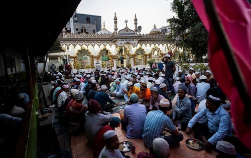 Muslims having Ramadan's Iftar at a amosque during Muslim holy month of Ramadan in Guwahati, India
