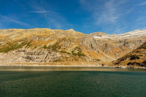 View from the Kölnbrein reservoir. The Kölnbrein Dam is an arch dam that was constructed between