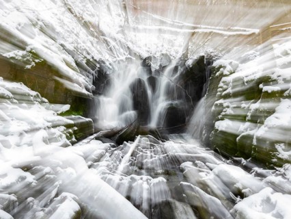 Abstract image of the Teufelsmühle waterfall on the hill stream the Schwartzbach, in snow and ice
