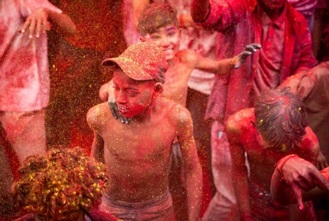 Revellers smear with Gulal or coloured powder and dance to play Holi, the Hindu spring festival of