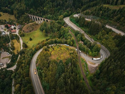 Winding road through forest and viaduct in hilly landscape, Ravenna Gorge, Black Forest, Germany,