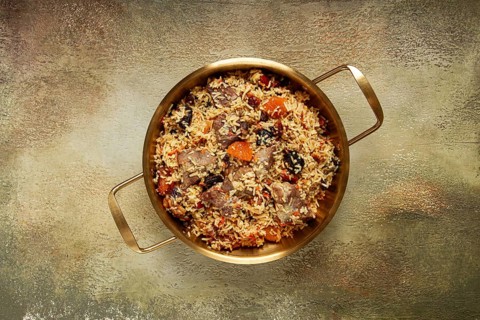 Rice dish with meat and dried fruits, in a large pot, pilaf, homemade, no people