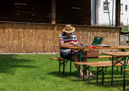 Hobby painter in an empty beer garden, Murnau, Bavaria, Germany, Europe