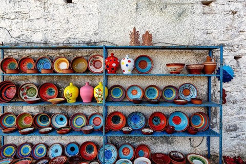 Colourful ceramics, outdoor shelf, pottery, souvenir shop in the village of Pyrgos Dirou, Mani,