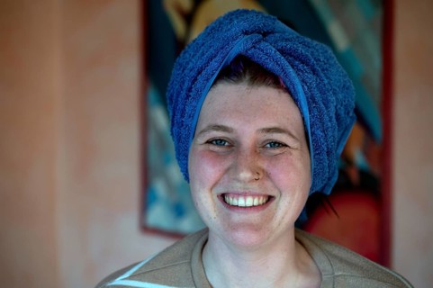 Portrait of a laughing young woman, the towel wrapped around her head like a turban, Bavaria,