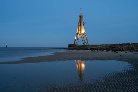 Illuminated spherical beacon with reflection, landmark, blue hour, North Sea, Lower Saxony Wadden