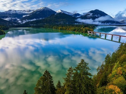 Snow-covered mountains reflected in lake, sunny, bridge, autumn, Sylvensteinsee, Karwendel