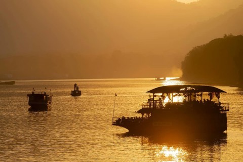 Sunset on the Mekong with excursion boats, near Luang Prabang, Laos, Asia