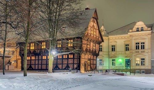 Amtspforte and Alte Polizei Winter snow illuminated Stadthagen Germany