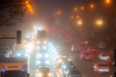 Dense fog, with visibility sometimes less than 100 metres, city centre traffic at rush hour on
