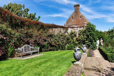 Gallery on a wall, bench, Sissinghurst Castle and Garden, Cranbrook, Kent, England, Great Britain