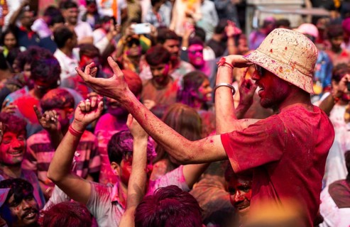Revellers smear with Gulal or coloured powder and dance to play Holi, the Hindu spring festival of