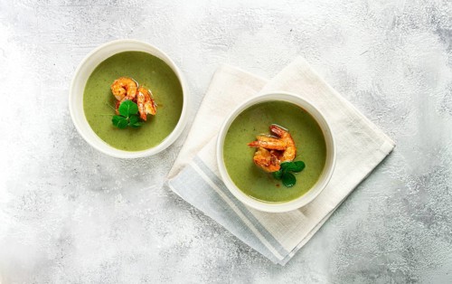 Pea cream soup, with shrimp, green soup, homemade, top view, no people